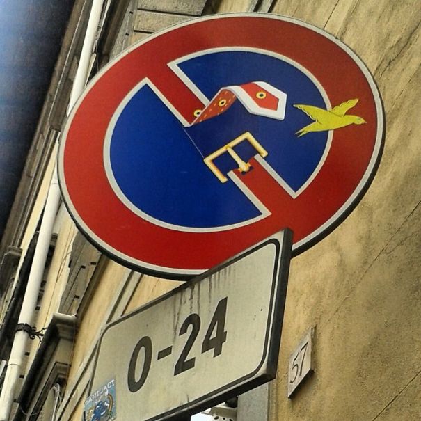 Street Sign Art By Abraham Clet - Barcelona Street Sign Art By Abraham Clet - Barcelona