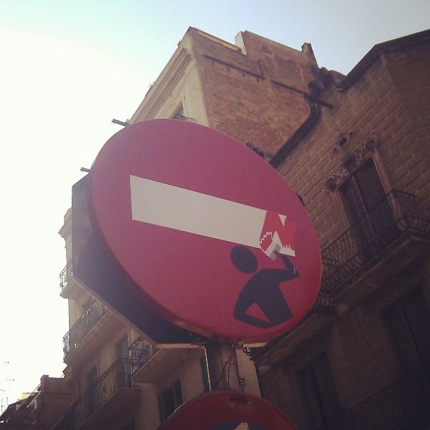 Street Sign Art By Abraham Clet - Barcelona Street Sign Art By Abraham Clet - Barcelona