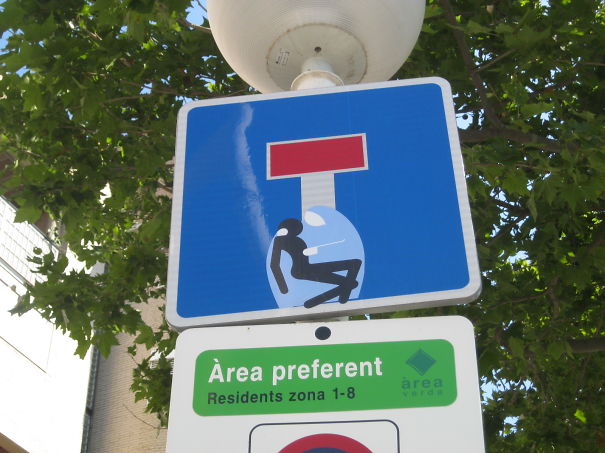 Street Sign Art By Abraham Clet - Barcelona Street Sign Art By Abraham Clet - Barcelona