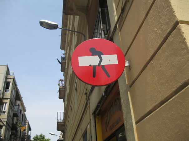 Street Sign Art By Abraham Clet - Barcelona Street Sign Art By Abraham Clet - Barcelona