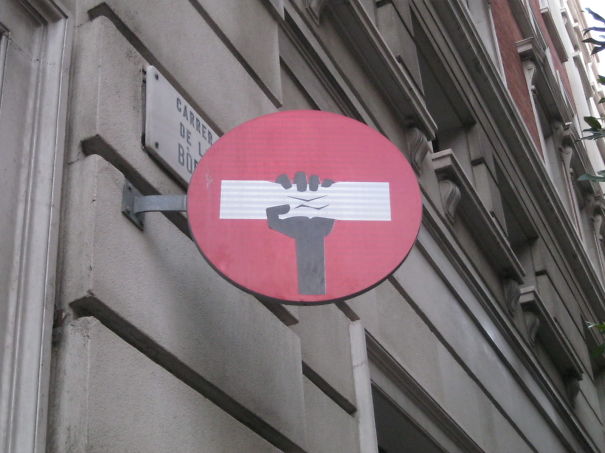 Street Sign Art By Abraham Clet - Barcelona Street Sign Art By Abraham Clet - Barcelona