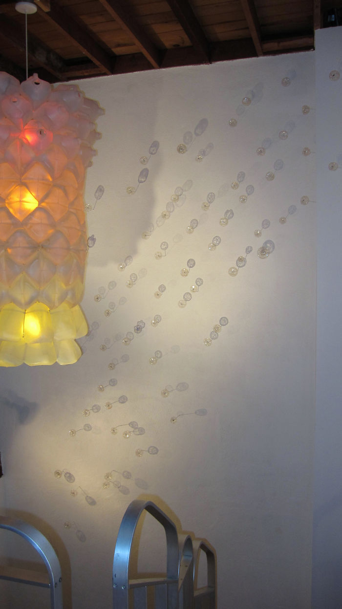 Wall Flowers Made From Bottle Bottoms And A Milk Jug Lamp