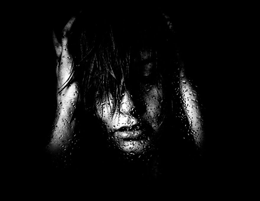 woman holding her head by hands woman holding her head by hands