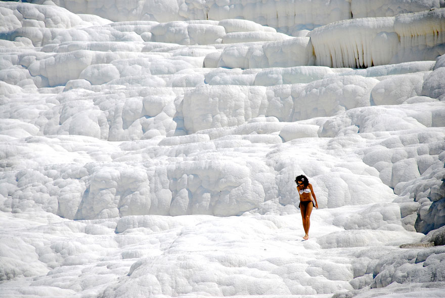 Woman walking on salt in Pamukkale, Turkey Woman walking on salt in Pamukkale, Turkey