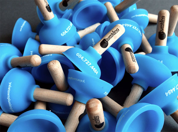 Creative business cards designed as blue mini plungers with contact details. Creative business cards designed as blue mini plungers with contact details.