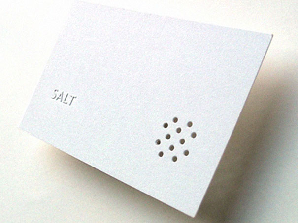 Minimalist business card design with the word "SALT" and perforated dot pattern. Minimalist business card design with the word "SALT" and perforated dot pattern.