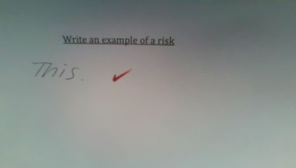 Smartass kid's test answer: "Write an example of a risk." Response: "This." with a checkmark. Smartass kid's test answer: "Write an example of a risk." Response: "This." with a checkmark.
