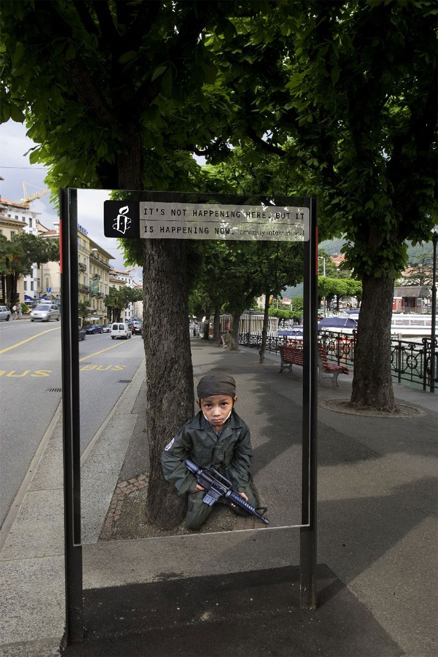 Powerful advertisement showing a child soldier in a city setting, highlighting global issues through striking imagery. Powerful advertisement showing a child soldier in a city setting, highlighting global issues through striking imagery.