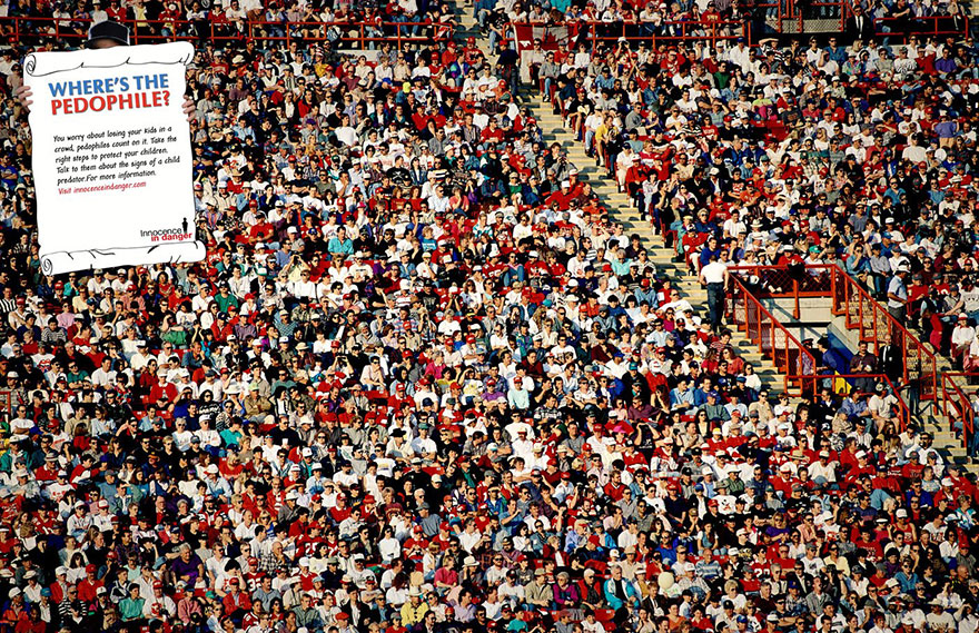 Crowded stadium with a thought-provoking safety message highlighting child protection awareness. Crowded stadium with a thought-provoking safety message highlighting child protection awareness.