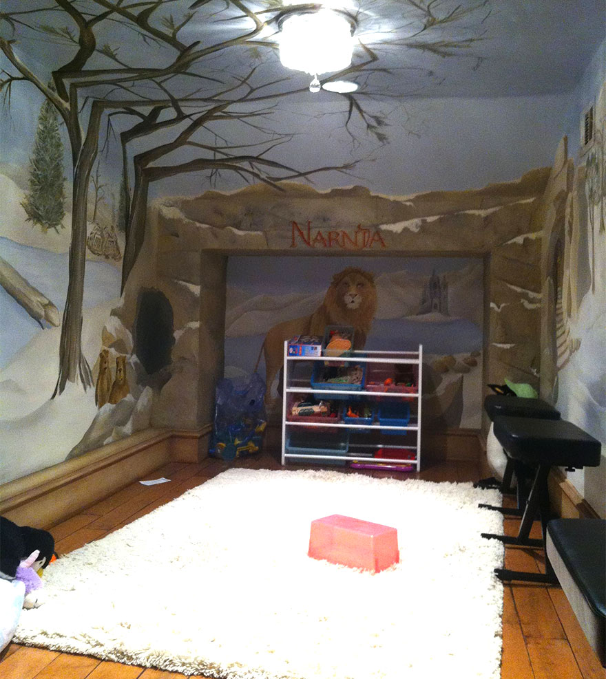 Kids room with creative Narnia-themed wall murals, toy storage, and cozy white rug for imaginative play and relaxation. Kids room with creative Narnia-themed wall murals, toy storage, and cozy white rug for imaginative play and relaxation.