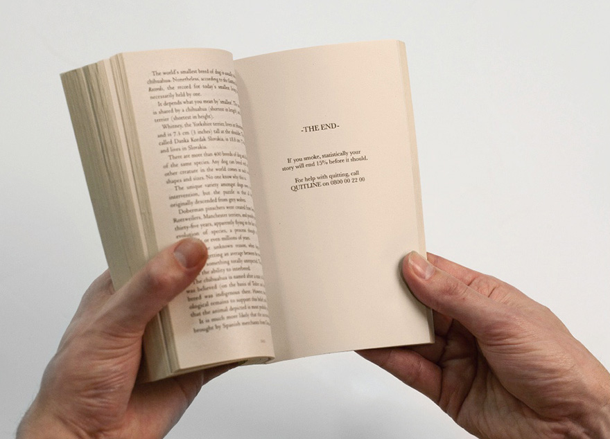 Person holding a book with an anti-smoking advertisement. Person holding a book with an anti-smoking advertisement.