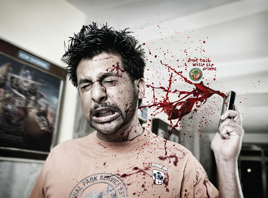 Powerful advertisement showing a man with a phone, blood splatter effect, and the message "Don't talk while she drives. Powerful advertisement showing a man with a phone, blood splatter effect, and the message "Don't talk while she drives.