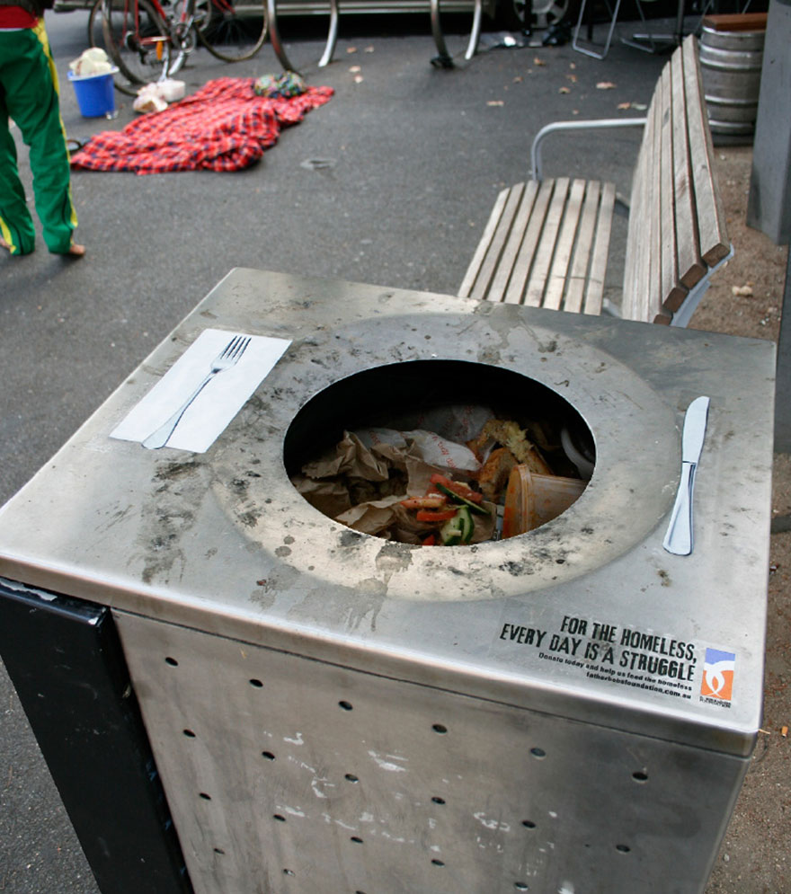 Trash can designed as a dining table, with utensils and an impactful message on homelessness. Trash can designed as a dining table, with utensils and an impactful message on homelessness.