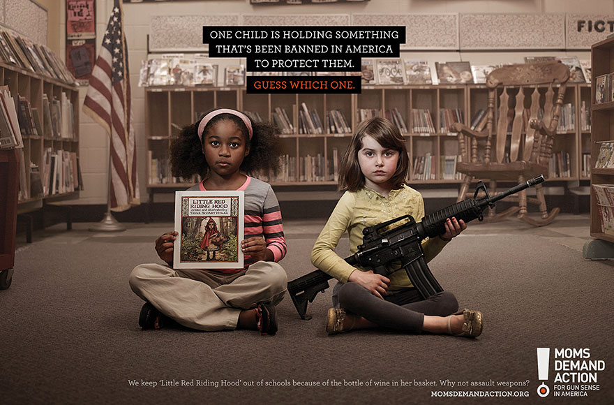 Two children in a library, one holding a book and the other a gun, highlighting powerful advertisement message. Two children in a library, one holding a book and the other a gun, highlighting powerful advertisement message.