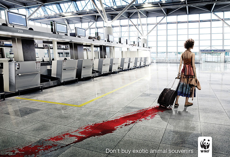 Traveler with suitcase leaving red stain on airport floor, urging awareness of powerful advertisement on exotic animal souvenirs. Traveler with suitcase leaving red stain on airport floor, urging awareness of powerful advertisement on exotic animal souvenirs.