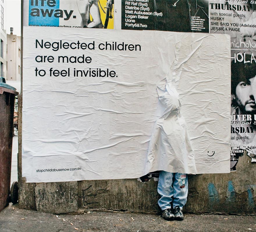 Powerful advertisement showing a poster with a message about neglected children feeling invisible. Powerful advertisement showing a poster with a message about neglected children feeling invisible.