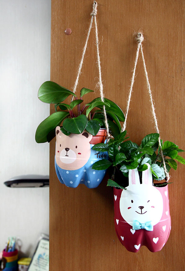 Hanging planters made from recycled plastic bottles with bear and rabbit designs. Hanging planters made from recycled plastic bottles with bear and rabbit designs.