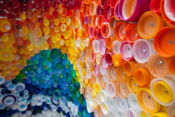 Colorful wall art made from recycled plastic bottle caps. Colorful wall art made from recycled plastic bottle caps.