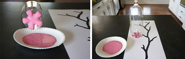 Plastic bottle used as a stamp with pink paint to create art on paper with a tree branch design. Plastic bottle used as a stamp with pink paint to create art on paper with a tree branch design.