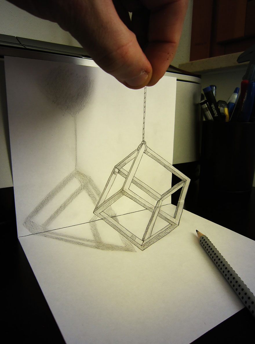 Realistic 3D drawing of a cube illusion with a hand holding the edge and a pencil nearby. Realistic 3D drawing of a cube illusion with a hand holding the edge and a pencil nearby.
