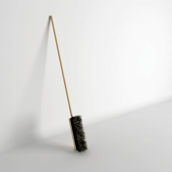 Interestingly placed broom top with a long handle Interestingly placed broom top with a long handle