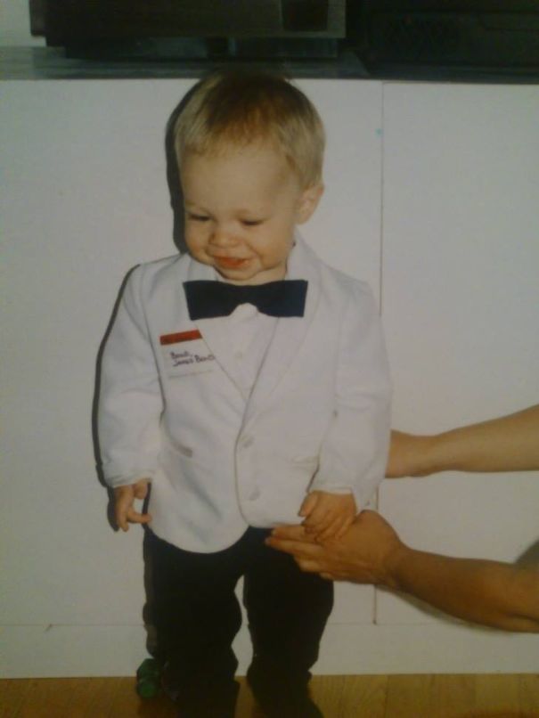 Toddler dressed in a white tuxedo with a bow tie, showcasing one of the children's Halloween costume ideas for inspiration.