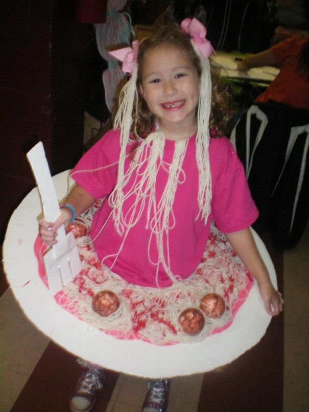 Young girl wearing a creative Halloween costume inspired by spaghetti and meatballs for children's Halloween costume ideas.