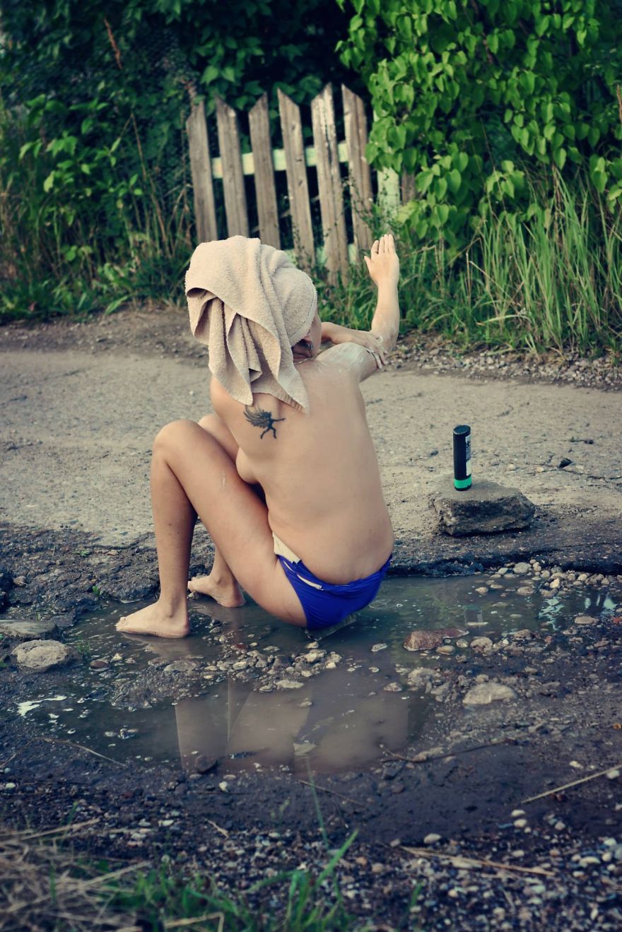 Friends Take Funny Pothole Photos To Draw Government's Attention To Poor Road Conditions In Kaunas Friends Take Funny Pothole Photos To Draw Government's Attention To Poor Road Conditions In Kaunas