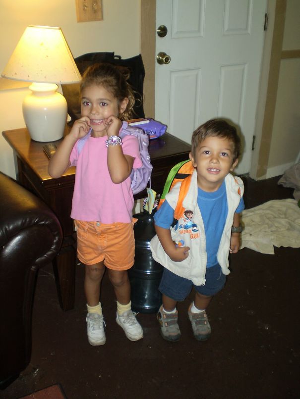 Two young children indoors wearing backpacks, posing and smiling, showcasing children's Halloween costume ideas.