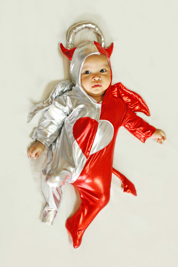 Baby wearing a red and silver costume with devil horns and angel halo, perfect for children's Halloween costume ideas.