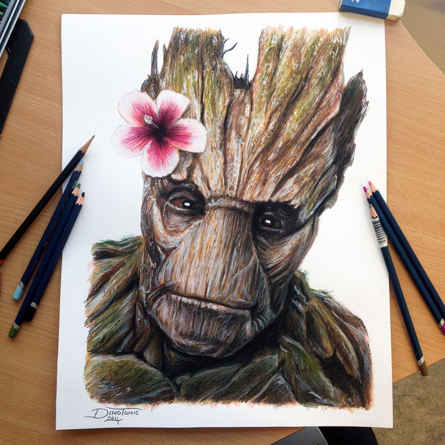 Expressive pencil drawing by Dino Tomic of a tree-like face with a pink flower and colored pencils on a table. Expressive pencil drawing by Dino Tomic of a tree-like face with a pink flower and colored pencils on a table.