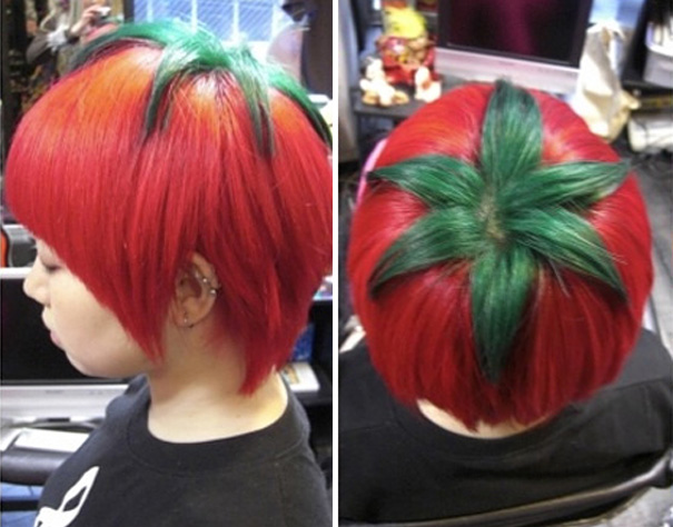 A person with a crazy haircut resembling a tomato, featuring red and green dyed hair styled creatively.