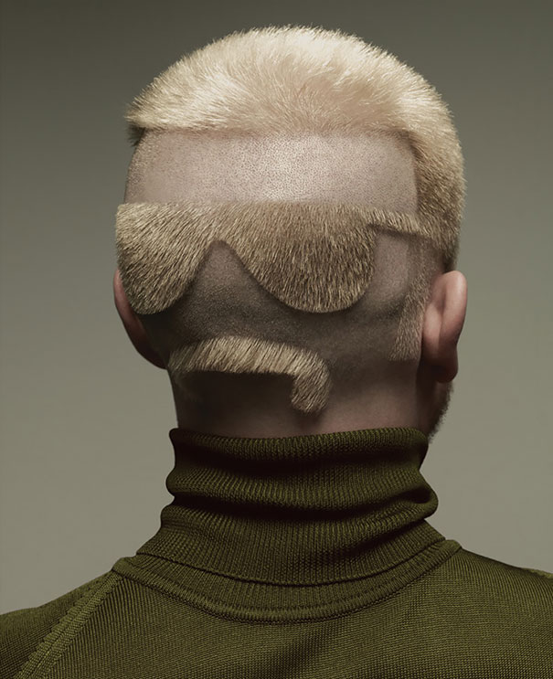 Unusual haircut featuring sunglasses and mustache design shaved on the back of a man's head.