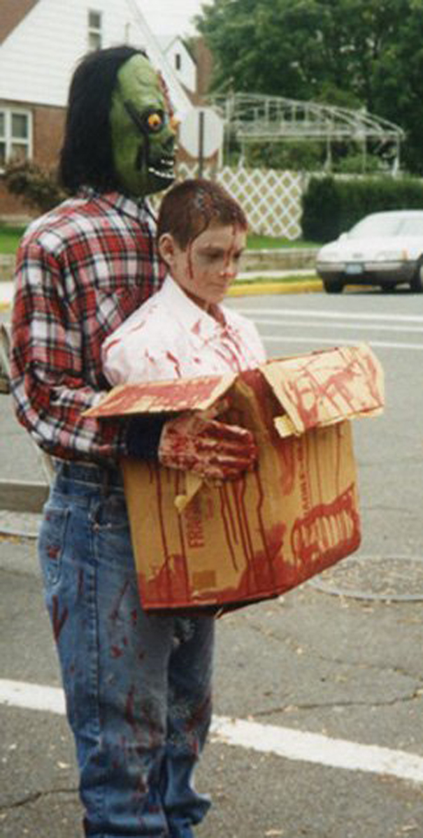 Two children in creative Halloween costumes with blood effects, perfect ideas for children's Halloween costume ideas.