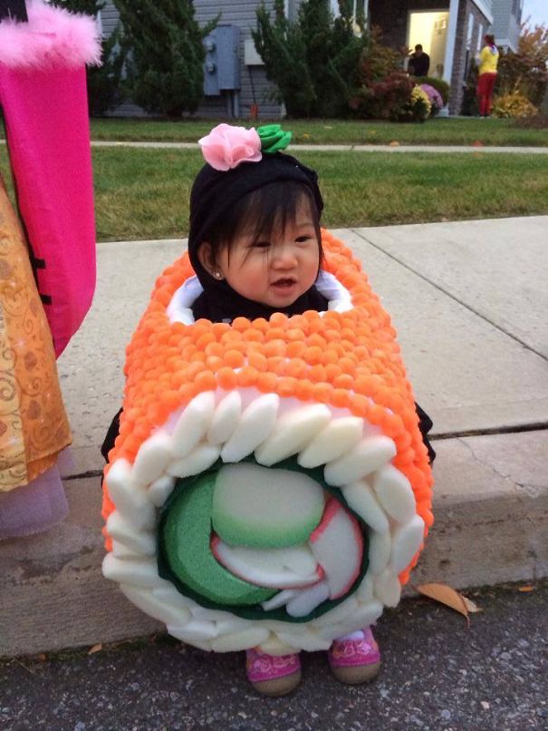 Toddler dressed in a creative sushi costume, showcasing one of the best children's Halloween costume ideas for trick-or-treating.