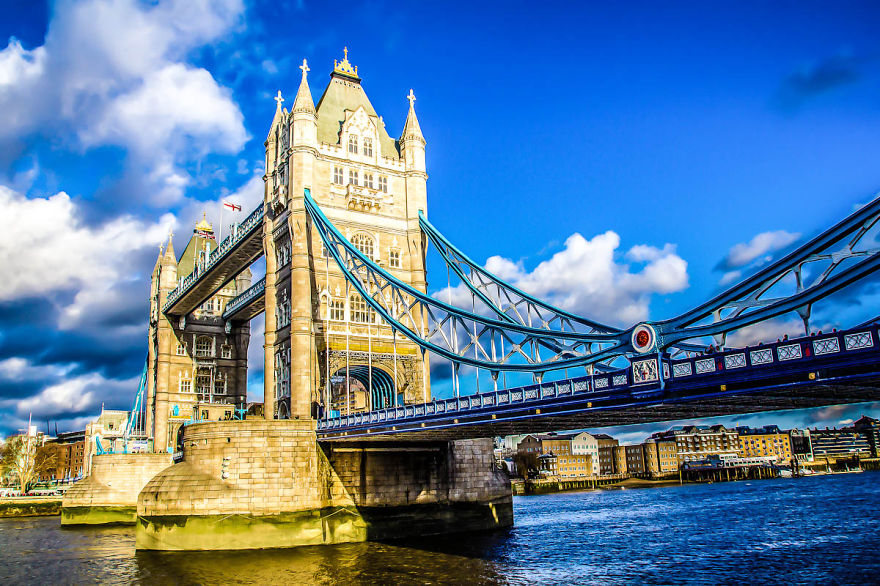 Tower Bridge over the River Thames in London on a bright day, showcasing one of the most mystical bridges in the world.