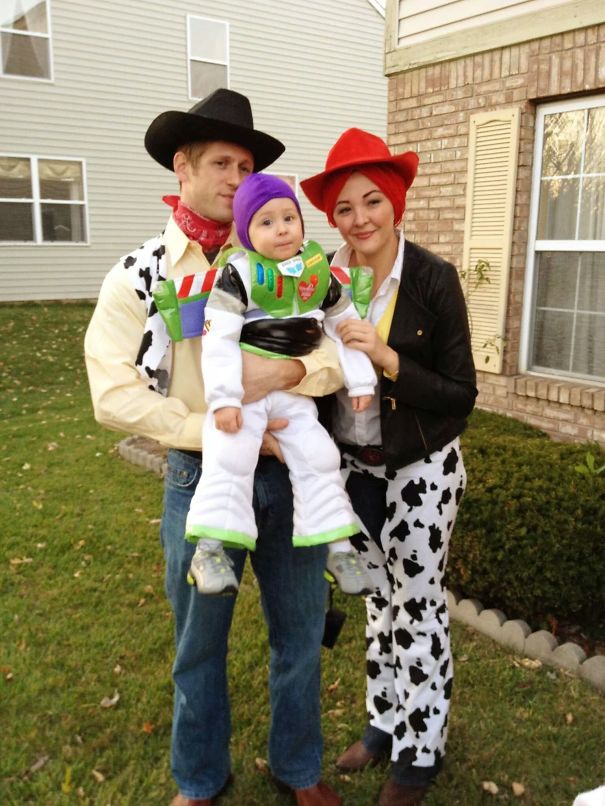 Family dressed in creative children's Halloween costume ideas with cowboy and space ranger outfits outdoors.