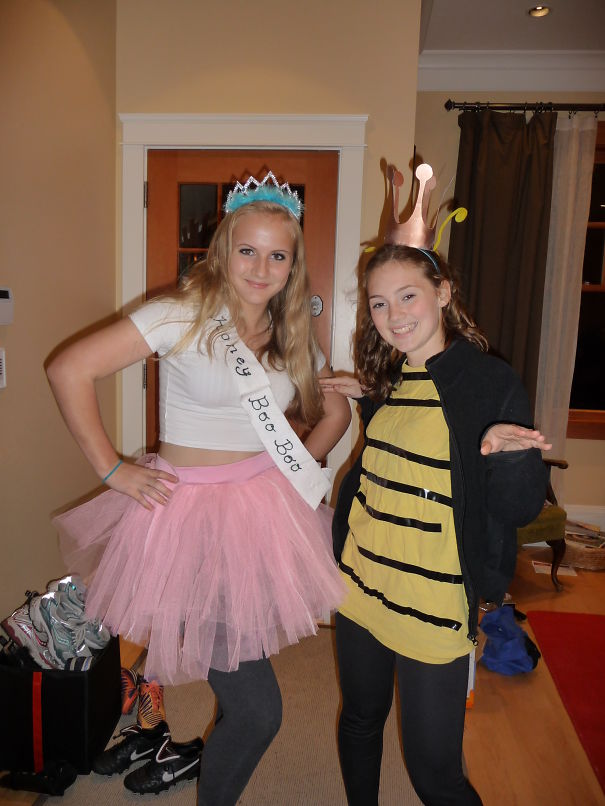 Two girls in Halloween costumes, one as a princess and the other as a bee, showcasing children's Halloween costume ideas.