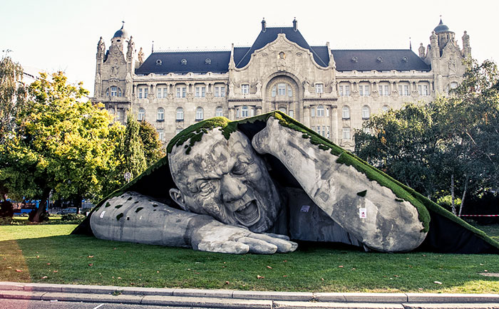 A Giant Sculpture Crawls Out Of The Ground In Public Square Of Budapest