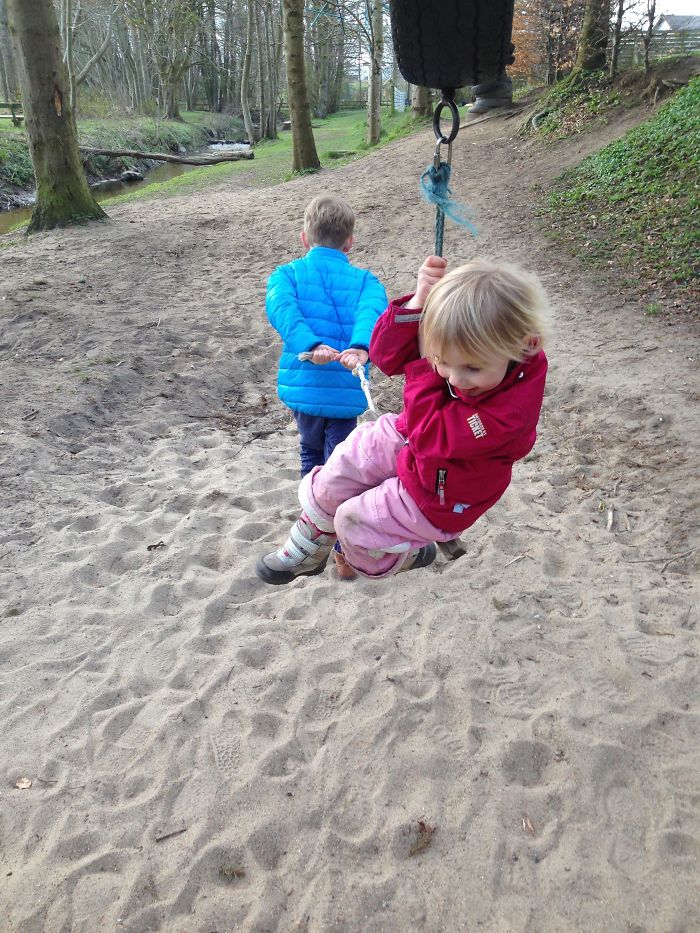 Brother Helps Little Sister On The Cable Car