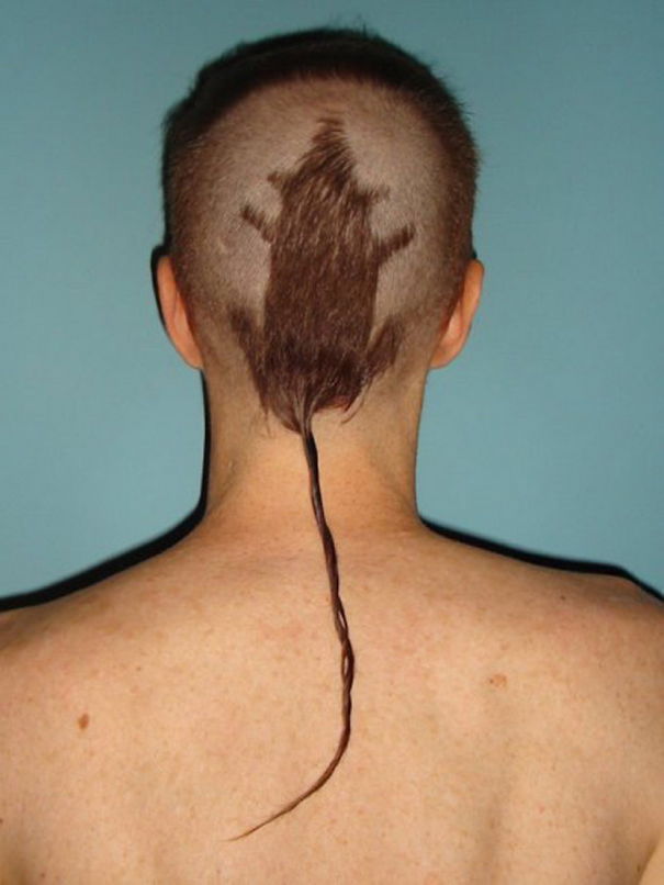 Unique haircut with a shaved head featuring a rat design and long hair resembling a tail, showcasing one of the craziest haircuts.