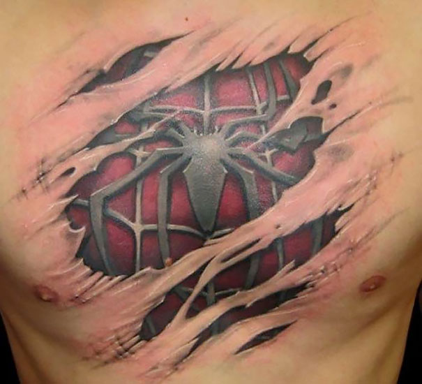 3D tattoo on chest resembling ripped skin revealing a spider design underneath.
