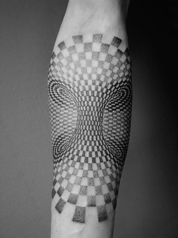 3D tattoo with optical illusion design creating a mind-bending, twisting effect on forearm.