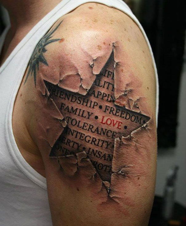 3D tattoo of a star with words like "family" and "love" on a person's upper arm, creating an illusion of torn skin.