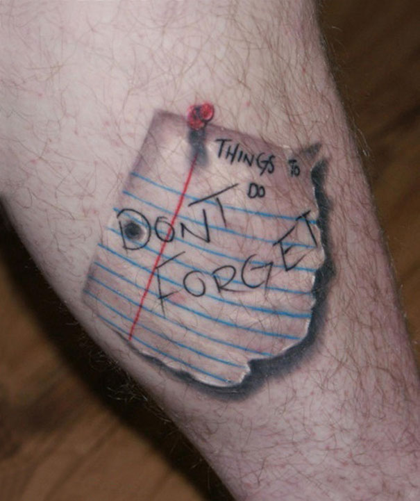 3D tattoo of a realistic notepad page on skin, with "Don't Forget" written in bold letters.