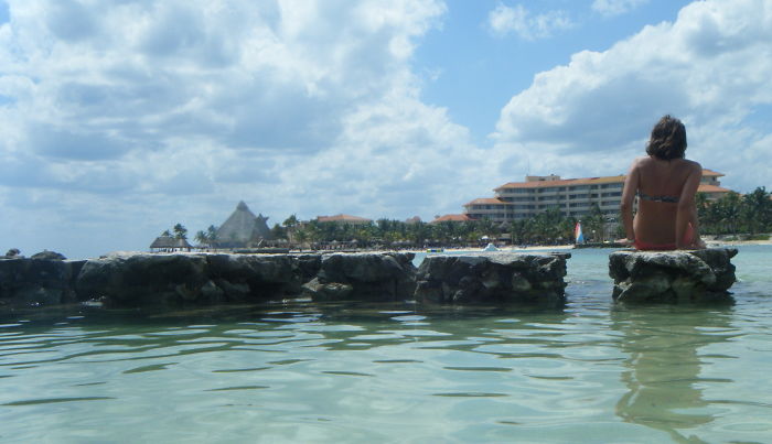 Girl On A Rock Looking Into The Ocean, Mexico
