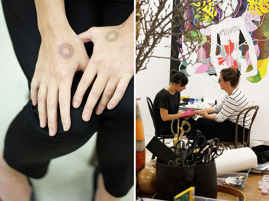 Minimalist tattoo artist inks a friend's hand in an eclectic studio setting. Minimalist tattoo artist inks a friend's hand in an eclectic studio setting.