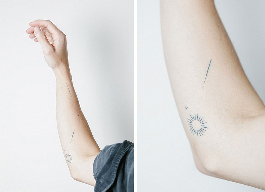 Minimalist tattoos on arm, featuring lines and sun design, by artist exchanging tattoos for food, lessons, or books.