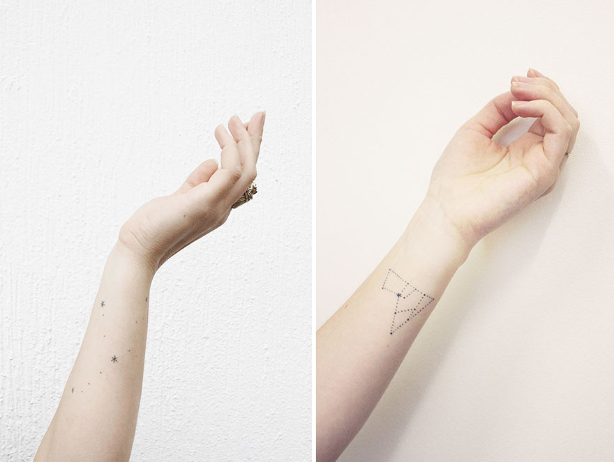 Minimalist tattoos on forearms, showcasing tiny star designs and a geometric shape.