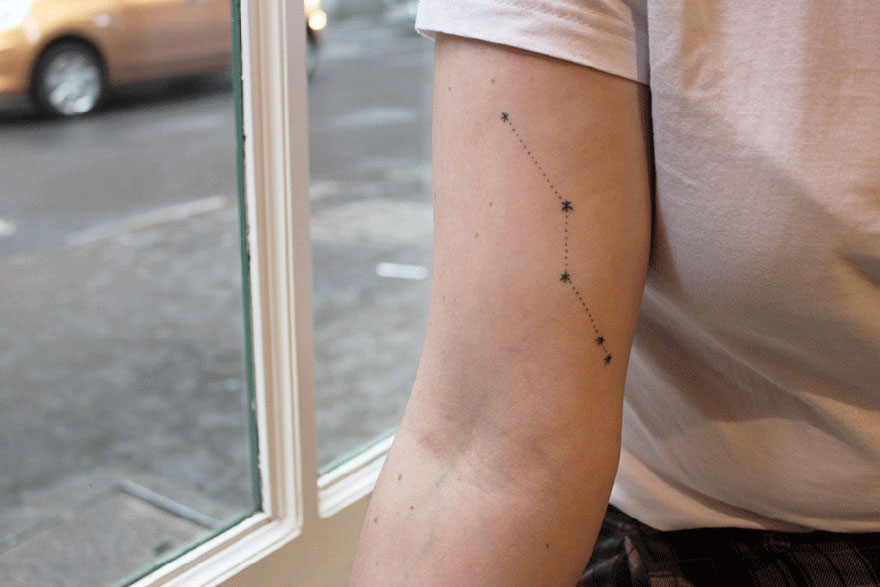 Minimalist tattoo of a constellation on an arm, designed by artist for barter. Minimalist tattoo of a constellation on an arm, designed by artist for barter.